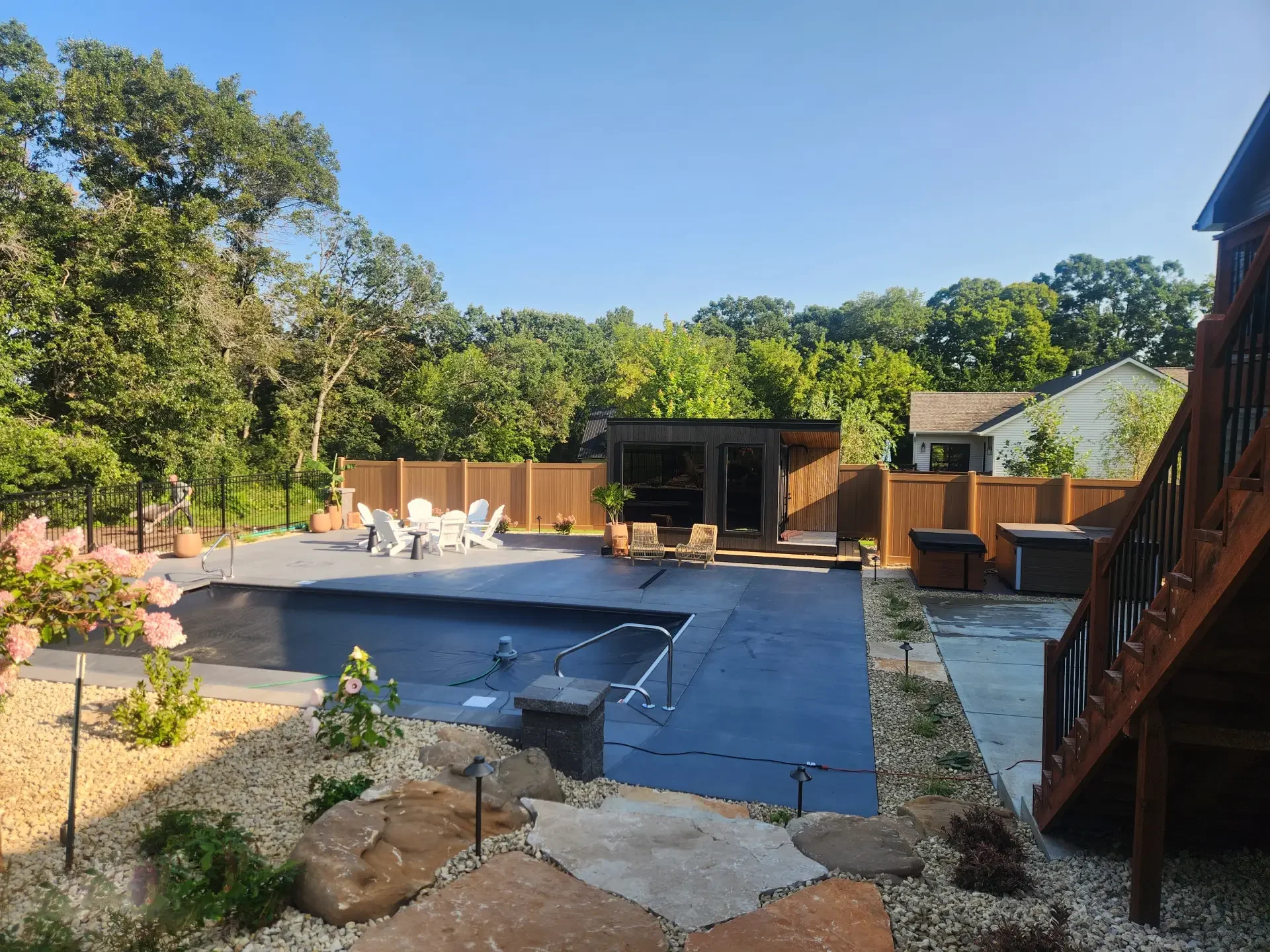 Spacious backyard swimming pool with generous deck space for outdoor gatherings